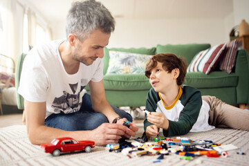 Family spends time together, dad and son build from constructor