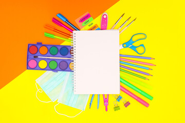 Back to school stationery on yellow background 