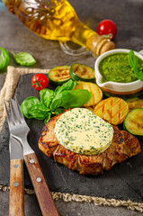 Delicious pork steak with herb butter - 374479307