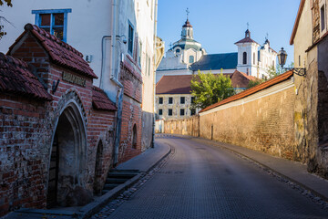 Fototapeta na wymiar An old and narrow street in Vilnius Old Town, Lithuania