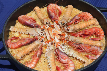 seafood paella with scampi and prawns as typical spanish food