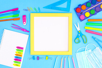 Back to school stationery on blue background 