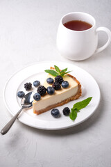 Classic New York Cheesecake And Tea on grey  Background, Tea and Cheesecake 