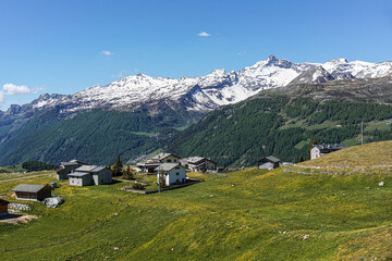 The pastures, the mountains and the nature while hiking above the village of Madesimo, Italy - June 2020.