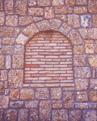 stonewall with arch frame shape and brickwork, textured pattern background