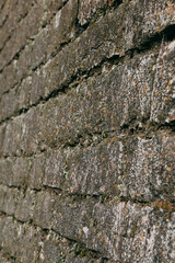An old stone medieval wall, a natural background, a replica of the cosmos.