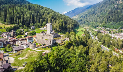 Fototapeta premium St. Michael castle in Ossana stands on a rocky outcrop. Ossana castle in the village of Ossana in Val di Sole, Trentino Alto Adige, Italy. Panoramic view