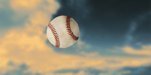 Baseball ball in the air, close-up. Sky background