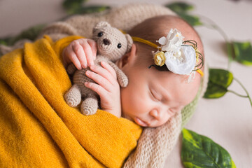 Newborn baby sleeping, on brown background.