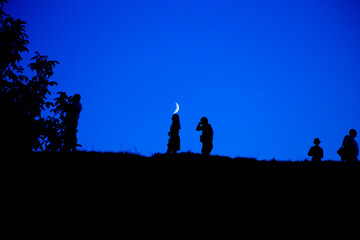 Silhouette of a group of people against the sky