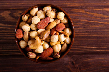 Naklejka na ściany i meble Nut mix in a wooden bowl