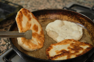 Pan-fried pastry. Baking pastry in the pan. Turkish pastry type bagel 