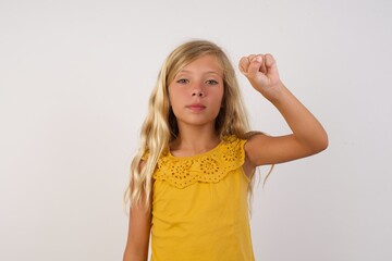 Little girl with beautiful blonde hair over white background pointing up with fingers number ten in Chinese sign language Shi