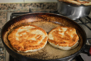 Pan-fried pastry. Baking pastry in the pan. Turkish pastry type bagel 