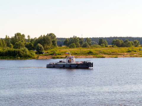 Kasimov, Russia - July 24, 2015: Barge goes along Oka River near town of Kasimov on summer day.