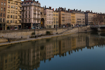 Fototapeta na wymiar Cityscape of Lyon city by the river with building reflections on the water
