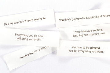 Slips from fortune cookies with prediction top view