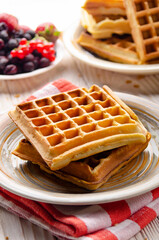 Belgian waffles served with butter banana mint leaf and syrup
