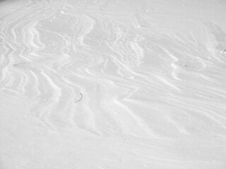 Fototapeta na wymiar Abstract footprints on white snow as background for any project Christmas