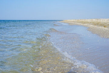 azure sea with clear waters off the coast of a white sand island