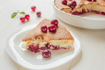 Slice of freshly baked cherry pie. Simple homemade food. Close up with shallow dof.