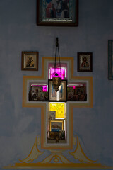  Iconostasis in a small tourist chapel. Colored glass cross.