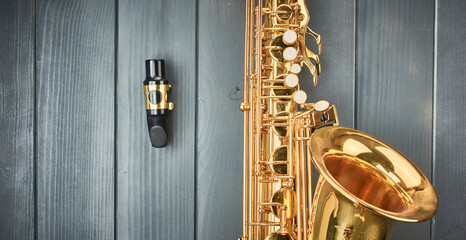saxophone mouthpiece with dental guard and metal clamp for adjusting the golden reed and instrument...