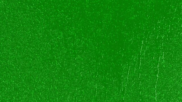 Close-Up. Realistic rain and water droplets with chroma key green screen background. Animation 