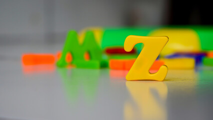 colorful letters on black background