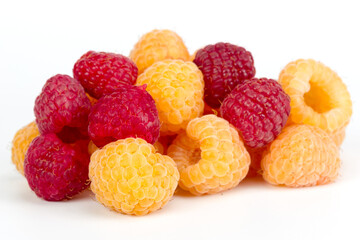 Lot of organic raspberries on white background. Selective focus