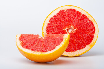 Grapefruit citrus fruit with half on white with clipping path