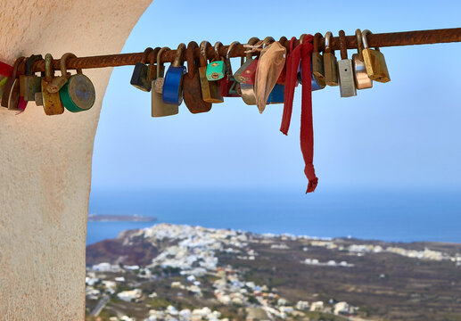 Oia views across love locks in Santorini