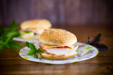 morning sandwich with bacon, cheese and herbs