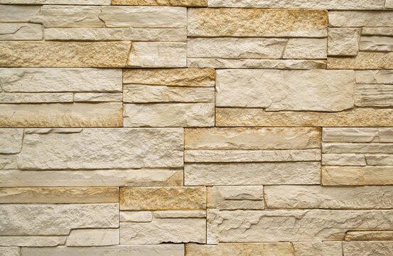 Wall finishing tiles in the form of white and beige stone