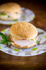 morning sandwich with bacon, cheese and herbs