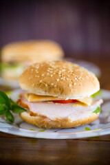 morning sandwich with bacon, cheese and herbs
