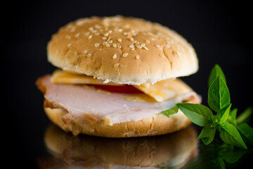 morning sandwich with bacon, cheese and herbs