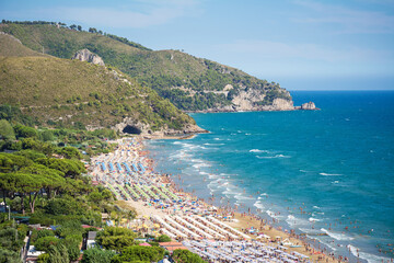 Panoramic view of Sperlonga golden sandy beach with the ancient roman Tiberius Villa. Italian Holidays.