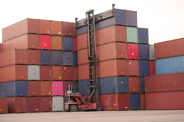 Empty container handler with side-lift spreader in yard
