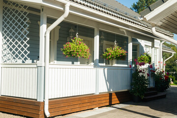 Traditional wooden house decorated with flowers in Finland