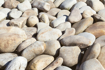 lot of stones close-up on beach, pebbles as textured background