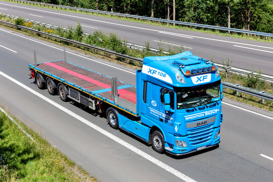 WIEHL, GERMANY - JUNE 26, 2020: Busch DAF XF flatbed truck on motorway.
