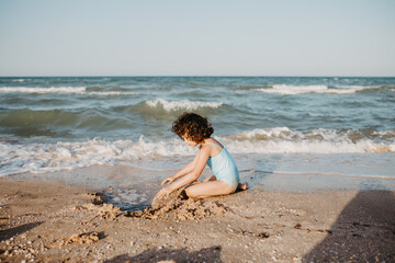 happy kids playing on beach in the day time