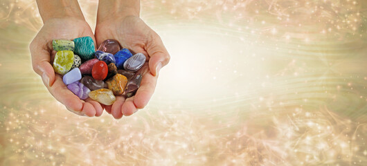 Crystal healing therapist website banner head - female crystal healer holding a selection of...