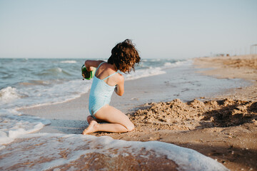 happy kids playing on beach in the day time