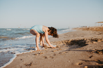 happy kids playing on beach in the day time