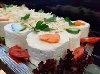 cheese plate served with various cheeses on the table