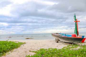 Fototapeta na wymiar A Beautiful Lonely Sea Shore with A beautiful Old Boat