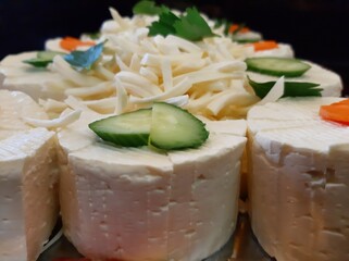 cheese plate served with various cheeses on the table