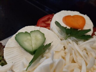 cheese plate served with various cheeses on the table